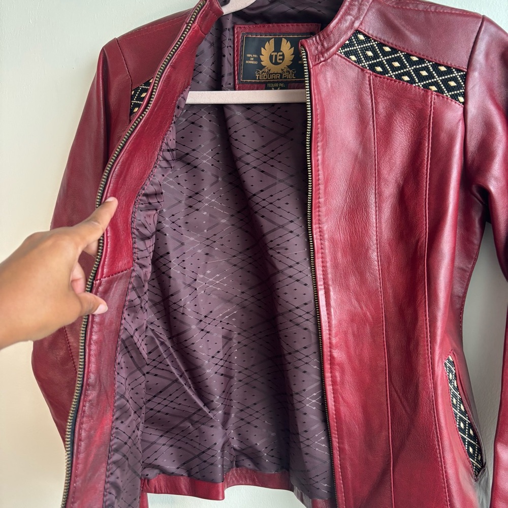 Chic Red Leather Jacket With Patterned Accents - image 6